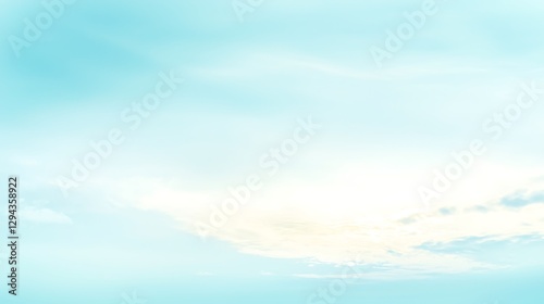 A soft light blue sky with a few cumulus clouds spread across, offering a calming and refreshing atmosphere.