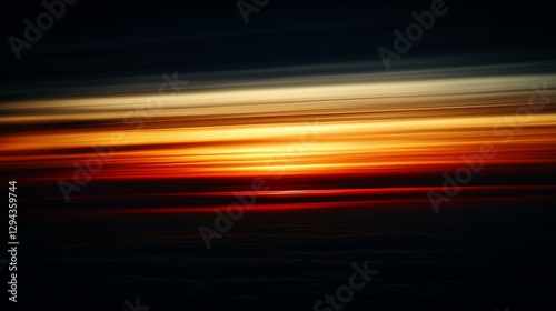 A beautiful sunset sky with deep orange and yellow hues transitioning into each other, casting a golden glow across the horizon.