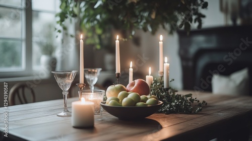 A beautifully arranged coffee table with candles and fruit centerpiece creates an elegant ambiance