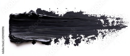 Dramatic black paint stroke on white background showcasing texture and depth for creative projects photo