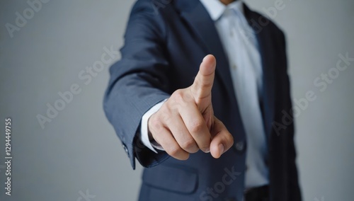 Businessman Pointing Finger to Emphasize Important Message