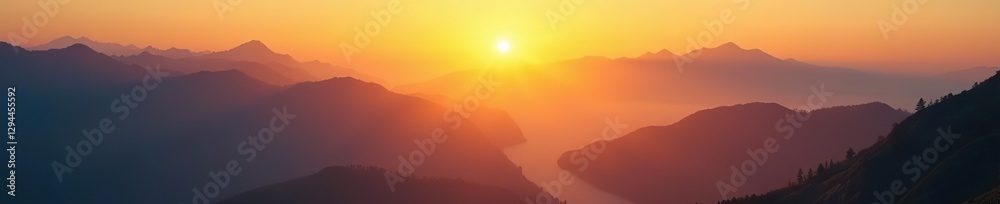Obraz premium Golden sunrise over mystical mountain range with radiant mist and fog, serene landscapes, peaceful dawn, rugged terrain