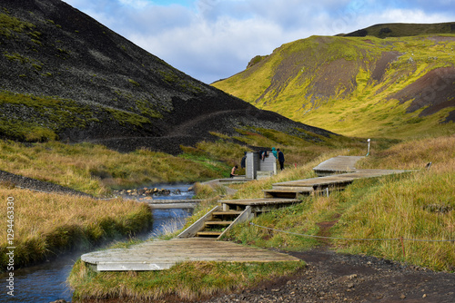 Hot springs and river at Reykjadalur valley in Iceland on a sunny day