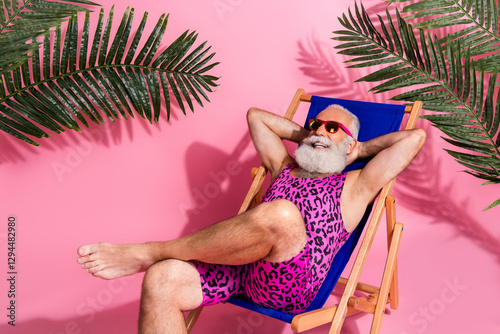 Obraz na plátne Photo of positive senior man wear swimwear hold arms behind head relax rest chai