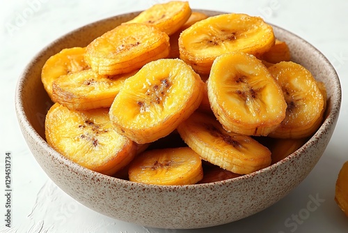 A bowl of sweet and delicious fried plantains on a table