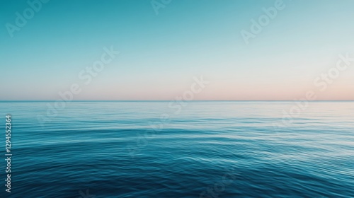 The horizon blends seamlessly into calm ocean waves under a tranquil sky, capturing an infinite expanse of peace and natural beauty.