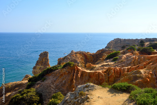 walking path with breathtaking views through the coast from porches to benagil caves lagoa algarve portugal