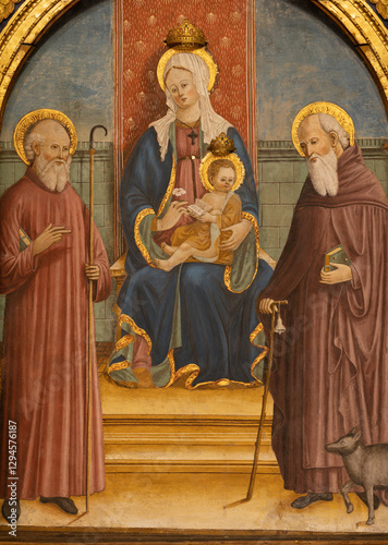 Pavia - The painting of Madonna and St. Giulio and St. Anthony the Abbot  in church Chiesa di Santa Maria del Carmien by unknown artist from second half of 15. cent. photo