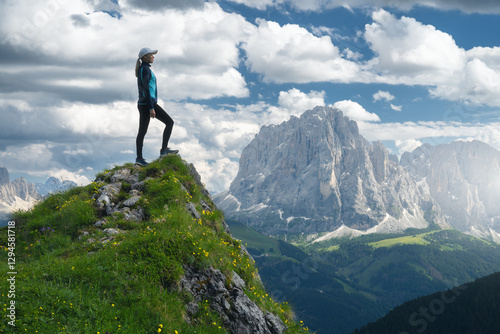 Girl on the mountain peak w...