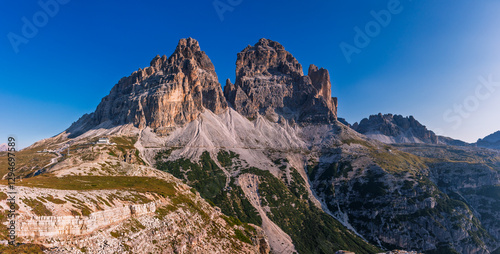 Tre Cime di Lavaredo during sunrise with warm golden light