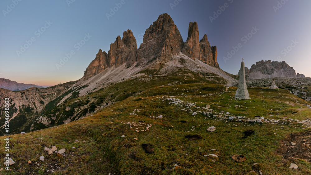 Tre Cime di Lavaredo during sunrise with warm golden light