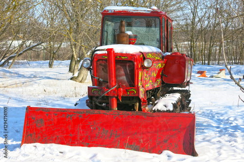 red tractor painted to resemble a Russian khokhloma