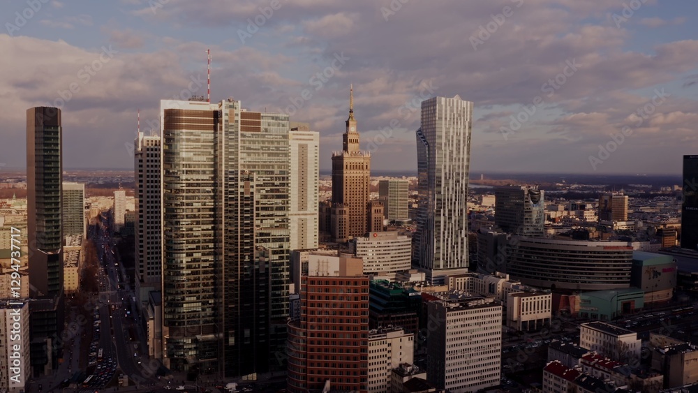 Palace of Culture and Science among the glass skyscrapers of Warsaw. Business center of a modern city from a bird's eye view, video from a drone. Palace of Culture and Science among the glass skyscrapers of Warsaw. Business center of a modern city from a bird's eye view, video from a drone.