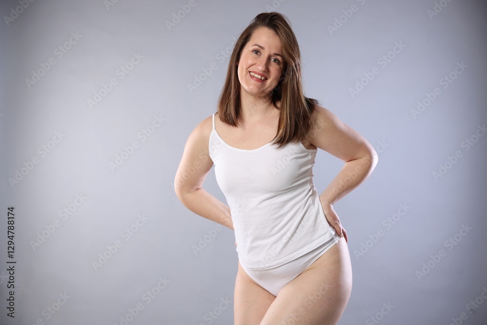 Woman in underwear on light grey background. Cellulite problem Woman in underwear on light grey background. Cellulite problem