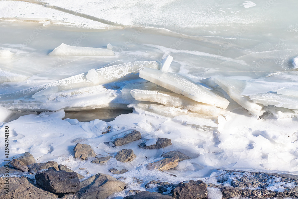 A pile of broken ice on the seashore