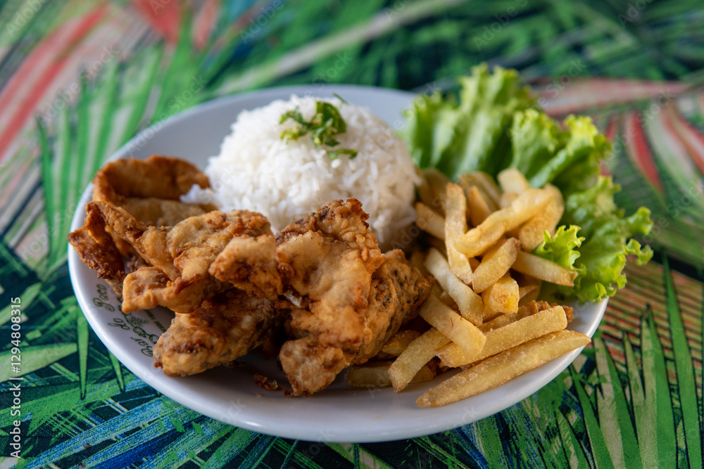 Brazilian dish made of fish with rice and fries Brazilian dish made of fish with rice and fries