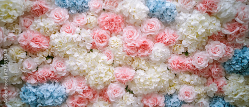 A vibrant arrangement of artificial flowers in pink, white, and blue hues.
