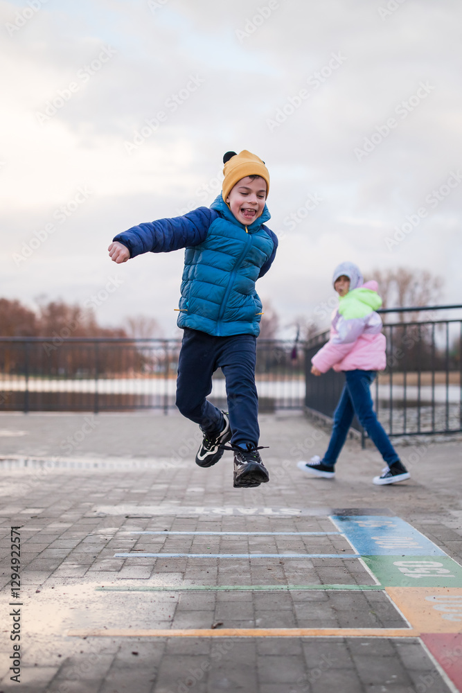Portrait of little adorable boy walking in park