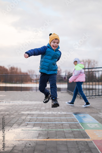 Obraz na płótnie Portrait of little adorable boy walking in park w salonie