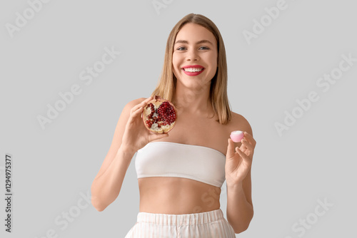 Young woman with pomegranat...