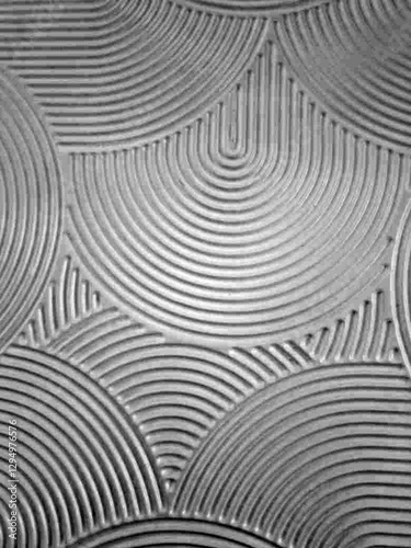 swooped and curved half moon swirl pattern with bumpy ridges