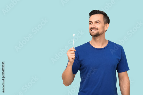 Handsome man with toothbrus...