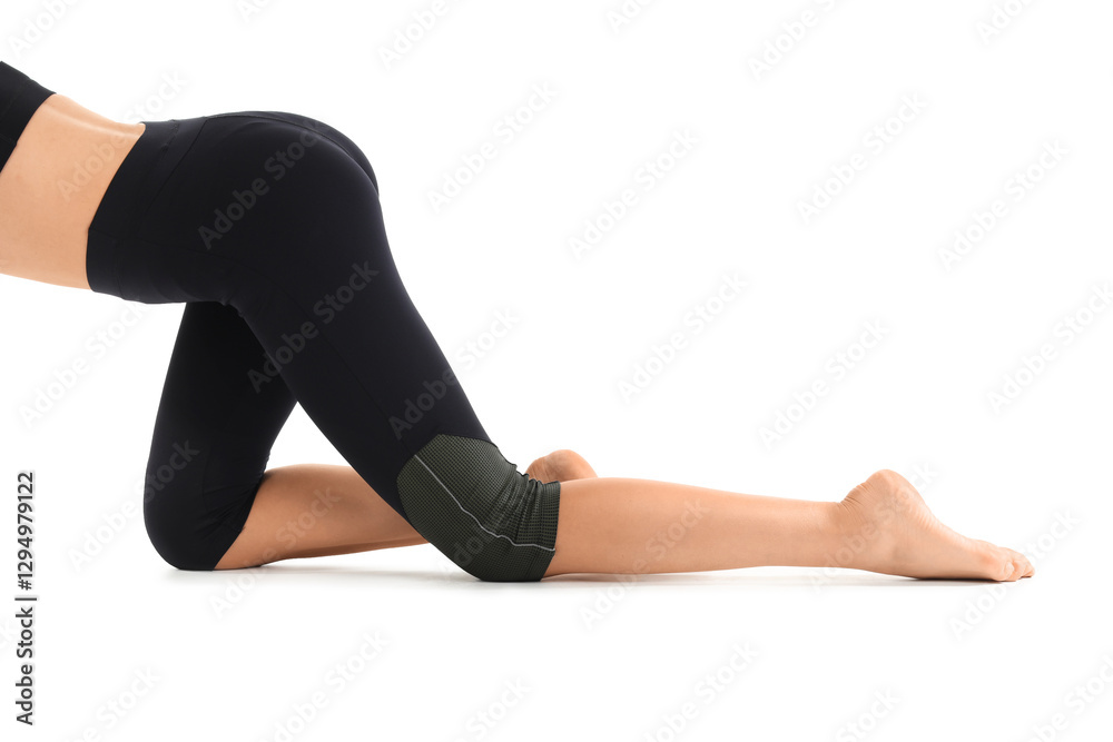Young woman in black cycling shorts on white background Young woman in black cycling shorts on white background