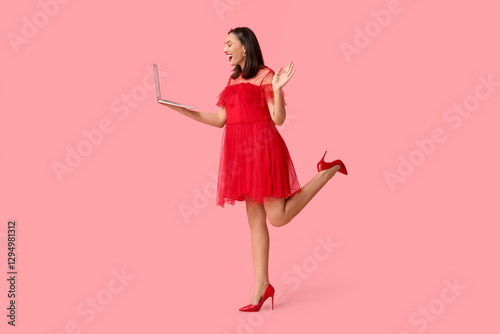 Happy young woman with lapt...