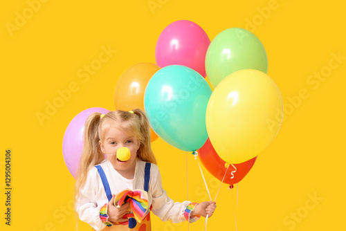 Funny little girl in clown ...