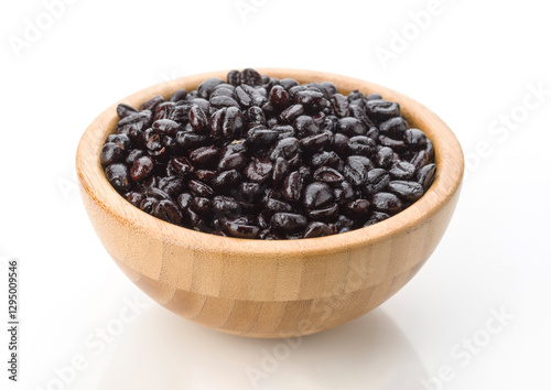 Freshly harvested black beans in a wooden bowl ready for cooking and meal preparation