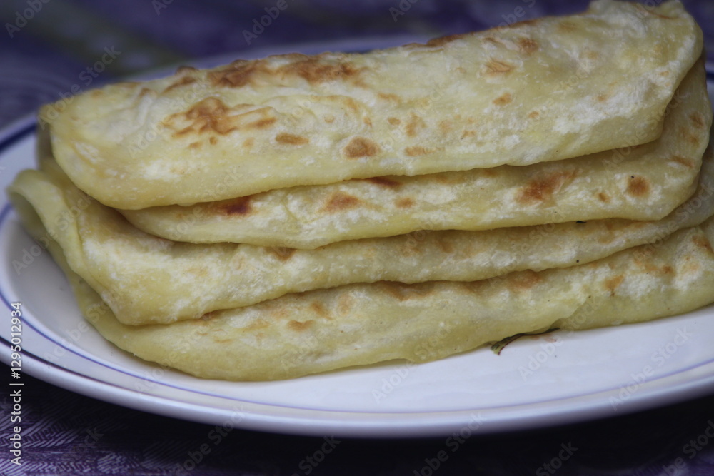 A close-up of the traditional Moroccan flatbread known as Msemmen or Msemen A close-up of the traditional Moroccan flatbread known as Msemmen or Msemen