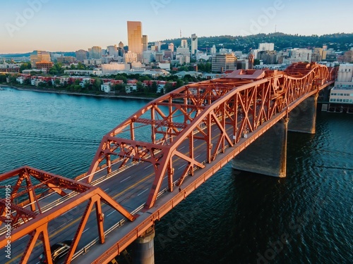 Aerial view of the Broadway Bridge over the Willamette River in Portland, OR. City skyline in the background. Golden hour light. Oregon, USA photo
