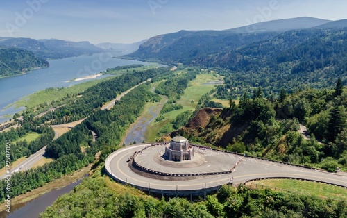 Panoramic view of the Historic Columbia River Highway, with the Vista House, a popular tourist destination. Scenic overlook offers stunning views of the Columbia River Gorge. Corbett, Oregon, USA photo