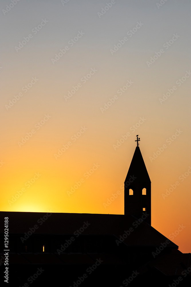 Silhouette of a christian church with sunset sky in Brazil