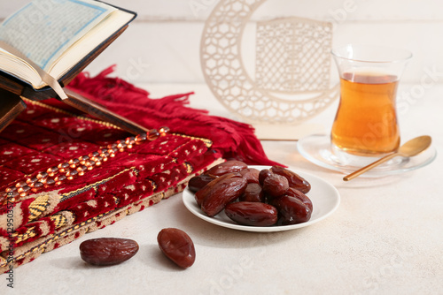 Dates, Koran, prayer carpet...