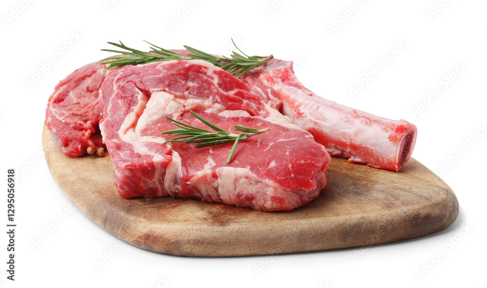 Pieces of raw beef meat and rosemary isolated on white Pieces of raw beef meat and rosemary isolated on white