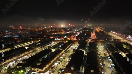 Wallpaper Mural Drone footage of Klang city at night, showcasing fireworks and illuminated streets Torontodigital.ca