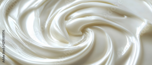 Close-up of a cream swirl on a white background  -  