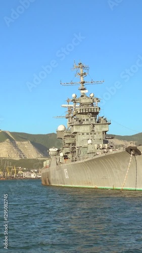 Big Russian military ship in port. Vertical video of a Russian port.