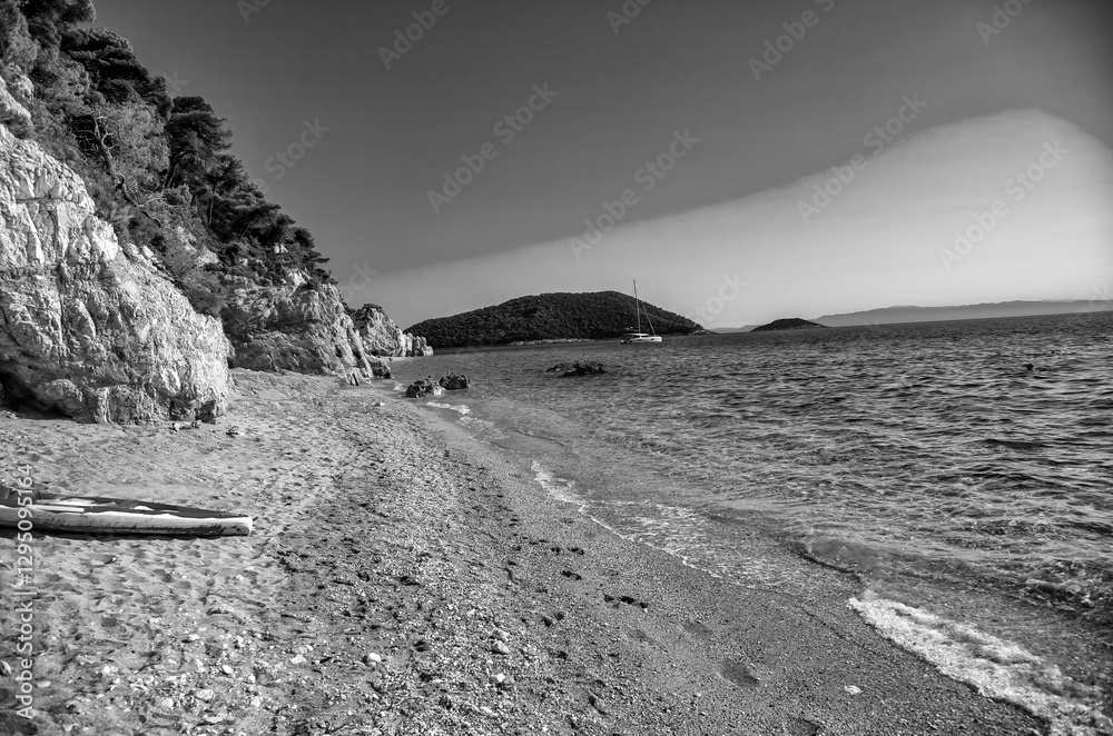 Scenic view of Skopelos coast with turquoise sea and lush green cliffs in summer