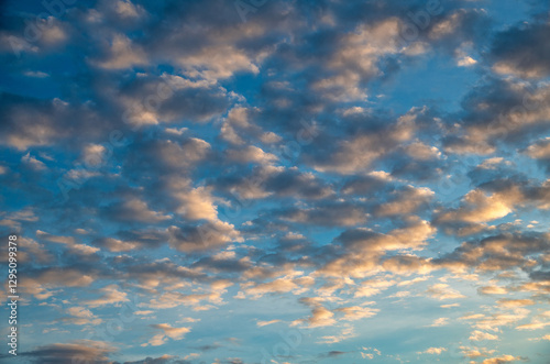 Magnificent evening sky at sunset casting golden hues over the sea