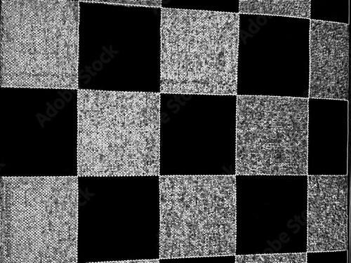 a black and gray checkered pattern background