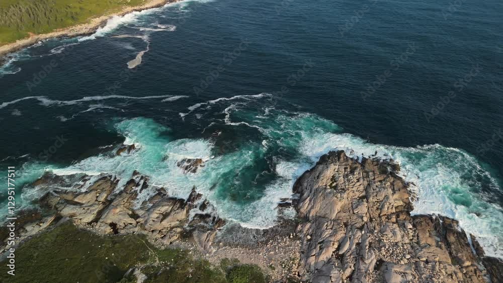 Aerial View Of Gentle Sea Waves Rolling Over A Rocky Shore At Sunset In Nova Scotia. The Beautiful Water Texture And Rich Sunset Colors Capture The Essence Of Summer By The Sea. Aerial View Of Gentle Sea Waves Rolling Over A Rocky Shore At Sunset In Nova Scotia. The Beautiful Water Texture And Rich Sunset Colors Capture The Essence Of Summer By The Sea.