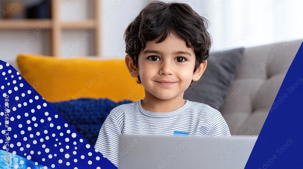 Smiling young boy working on a laptop computer indoors happily