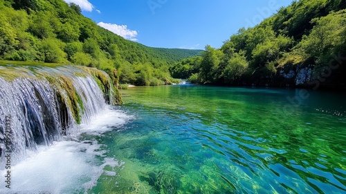 Stunning Natural Landscape with Vibrant Green Water and Waterfalls