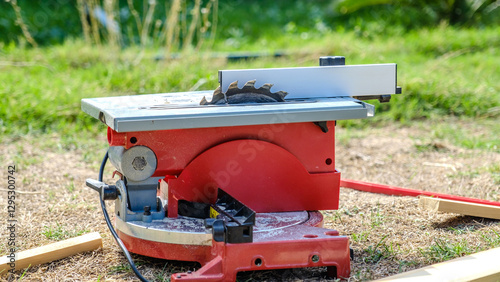A close-up shot of a circular saw cutting timber in a garden