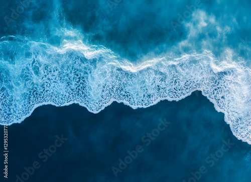 Aerial View of Ocean Waves Crashing on Shoreline, Revealing the Untamed Beauty and Dynamic Power of Nature's Coastal Landscape from Above
