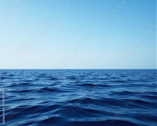 Wallpaper Mural A serene view of a vast ocean under a clear blue sky, showcasing the tranquil beauty of water meeting the horizon. Torontodigital.ca