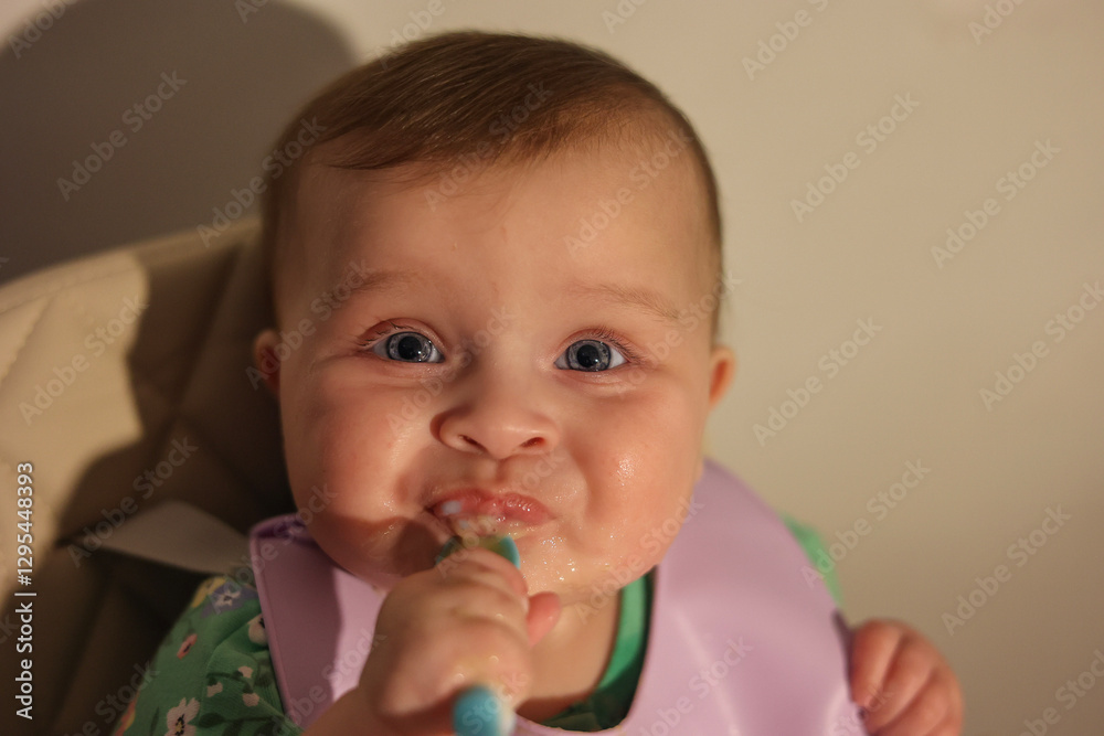 Adorable 6-Month-Old Baby Girl with Blue Eyes Eating Messy Baby Food
Adorable 6-Month-Old Baby Girl with Blue Eyes Eating Messy Baby Food