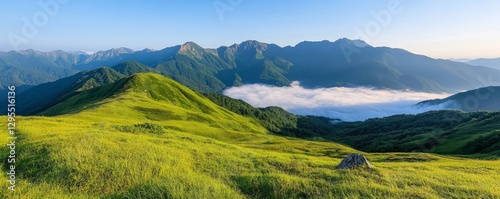 Serene Morning View of Lush Green Hills with Majestic Mountains and Misty Valley Below in Bright Natural Light